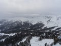 Aerial landscape of the snowy forest in the mountains. Royalty Free Stock Photo