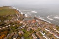 Aerial landscape view of Craster Harbour and village in Northumberland Royalty Free Stock Photo