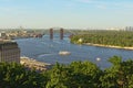 Aerial landscape view of Kyiv at summer sunny day. Beautiful Dnipro River with bridges and Obolon district.