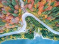 Autumnal landscape view of a mountain road and a lake Royalty Free Stock Photo