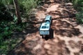 Aerial landscape view of off road vehicle towing a caravan