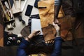 Aerial of leather craftsmen shaking hands together Royalty Free Stock Photo