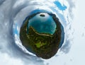Aerial little planet panoramic view of Lake Bled. Cloudy weather, heavy thunderstorm clouds on the horizon. Summer day. Season of