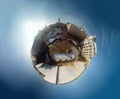 Aerial little planet view of the historical center of Chernivtsi, the central square and main streets on a sunny winter morning.