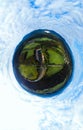 Aerial little planet view of the railway connection. Summer, sunny weather. Metal bridge over a mountain river. Transport and