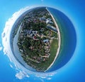 Aerial little planet view on tourist during summer vacation on beach at sea