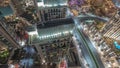 Aerial look down view of a big futuristic city night timelapse. Business bay and Downtown