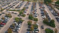Aerial many cars parked on public city carpark. Automobiles riding large parking Royalty Free Stock Photo