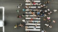 Aerial. Mass of people going through the pedestrian crosswalk. Top view