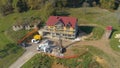 AERIAL: Massive drill bores a hole in the ground next to a CLT housing project.