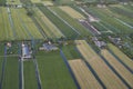 Aerial of modern farms with solar panels on the roof in dutch meadow landscape Royalty Free Stock Photo