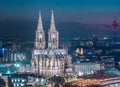 Aerial night panorama of the illuminated Hohenzollern bridge over Rhine river. Beautiful cityscape of Cologne, Germany Royalty Free Stock Photo
