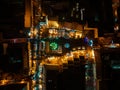 Aerial night shot of city during Christmas, winter and christmas decorations on square. Chistmas market during holiday Royalty Free Stock Photo