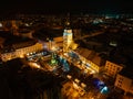 Aerial night shot of city during Christmas, winter and christmas decorations on square. Chistmas market during holiday Royalty Free Stock Photo