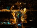 Aerial night shot of city during Christmas, winter and christmas decorations on square. Chistmas market during holiday Royalty Free Stock Photo