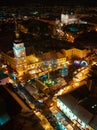 Aerial night shot of city during Christmas, winter and christmas decorations on square. Chistmas market during holiday Royalty Free Stock Photo