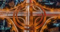 Aerial view of a complex highway interchange at night with light trails intersection traffic Royalty Free Stock Photo