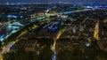 Aerial night timelapse view of Paris City and Seine river shot on the top of Eiffel Tower Royalty Free Stock Photo