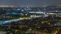 Aerial night timelapse view of Paris City and Seine river shot on the top of Eiffel Tower Royalty Free Stock Photo