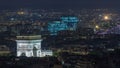 Aerial Night timelapse view of Paris City and Triumphal Arch shot on the top of Eiffel Tower Royalty Free Stock Photo