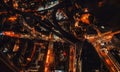 Aerial night view of central London near river Thames. Orange yellow illuminated streets, elevated train tracks above building Royalty Free Stock Photo