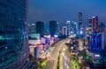 Aerial night view of fast moving traffic on the multi lane highway through urban city center with skyscrapers Highway Royalty Free Stock Photo