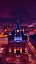 Aerial night view of an illuminated historic building in an urban landscape with vibrant purple skies in Liverpool, UK Royalty Free Stock Photo