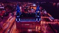 Aerial night view of an illuminated historic building in an urban setting with city lights in the background in Liverpool, UK Royalty Free Stock Photo