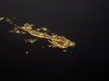 Aerial night view of Key West Florida  with illuminated city and black contours of the Straits of Florida Royalty Free Stock Photo