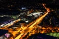 Aerial night view of modern city with circle road intersection Royalty Free Stock Photo