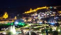 Aerial night view of Old Tbilisi, Georgia with Illuminated churches and narikala Castle