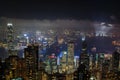 Aerial night view from Victoria peak to Kowloon bay and illuminated skyscrapers of Hong Kong island, China republic Royalty Free Stock Photo