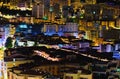 Aerial nightlight landscape of residential buildings in Monaco. Illuminated colorful buildings. Principality of Monaco