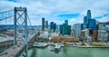 Aerial Oakland Bay Bridge with view of city skyscrapers and San Francisco Fire Department Pier