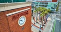Aerial Oracle Park 44 clock with palm trees and obscured Willie Mays statue