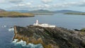 Aerial orbit view of Valentia Island Lighthouse at Cromwell Point. Ireland.