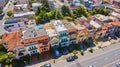 Aerial over colorful strip of California beach houses