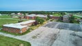 Aerial over huge abandoned brick hospital in Indiana
