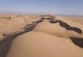 Aerial over huge sand dunes near the coastline