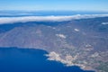 Aerial overcloud view on Tenerife island from airplane, Los Gigantes