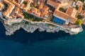 Aerial overhead drone shot of Dubrovnik City Wall by cliff and basketball field in Croatia summer morning Royalty Free Stock Photo