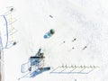 Aerial overhead drone view of school playground equipment covered in snow. Royalty Free Stock Photo