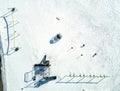 Aerial overhead drone view of school playground equipment covered in snow. Royalty Free Stock Photo