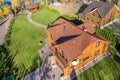 Aerial overhead elevated view of beautiful luxury big wooden modern house. Timber cottage villa with with green lawn Royalty Free Stock Photo