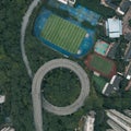 Aerial overhead shot of particular double circle 720 degree flyover in bushes buildings in Chongqing, China