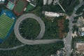 Aerial overhead shot of particular double circle 720 degree flyover in bushes residential buildings in Chongqing, China