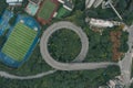 Aerial overhead shot of particular double circle 720 degree flyover in bushes residential buildings in Chongqing, China