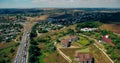 Aerial overlooking the hiway with cars, trucks and other transport.