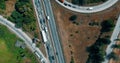 Aerial overlooking the hiway with cars, trucks and other transport.