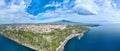 Aerial overview on Acireale city and Santa Maria la Scala seaport during summer sunny day with blue sky and colorful sea